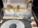 a record sitting on top of a wooden pallet next to a box