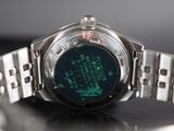 a close up of a watch on a table