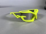 yellow goggles on a white table with a camera in the background