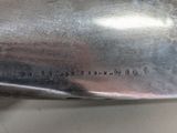 a close up of a silver spoon on a table