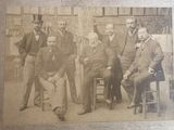 an old photo of a group of men posing for a picture