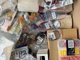 a cardboard box filled with electronic components and electronics