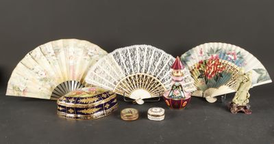 many different types of hand fans on the table