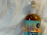 a bottle of rum in front of a white background