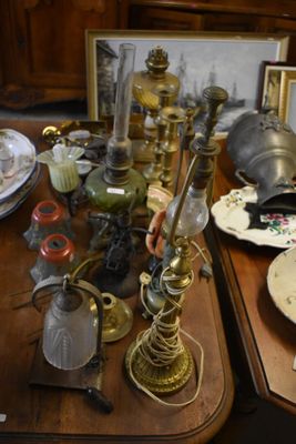 a wooden table with a lot of antique items on it