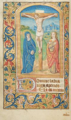 an old book with a painting of jesus on the cross
