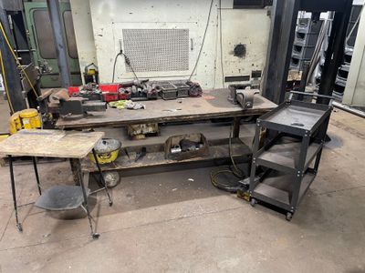 a workbench with a lot of tools on it