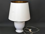 an image of a white lamp with a brown shade on it