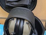 a pair of ear muffs in a case on the floor