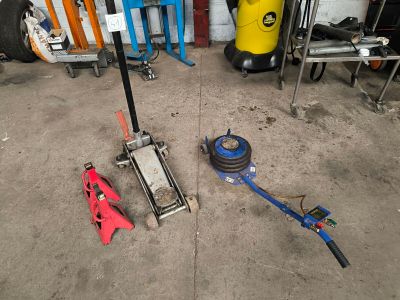 tools that are sitting on the floor in the garage