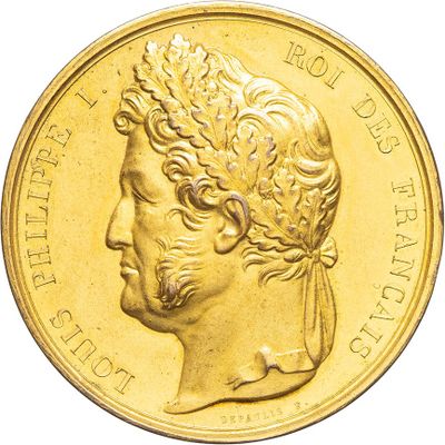 an image of a close up of a gold coin with a woman ' s face