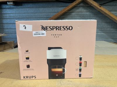 a box that has a coffee maker inside of it