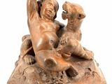 statue représentant un garçon et un chien sur un rocher, sur fond blanc