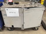 a metal box with a sign on it sitting in a garage