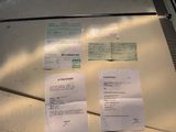 two papers on the table next to a pair of scissors