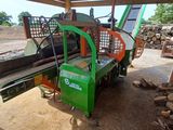 a green machine that is sitting in the dirt