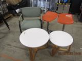 three tables and two chairs in a room