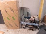a box that is sitting on the floor next to a machine