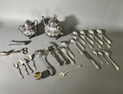 a lot of silver spoons and silverware on the table