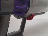 a purple and gray vacuum that is sitting on a table