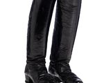a pair of black boots that are on a white surface