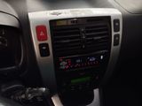 a car dashboard with a clock and a radio in it