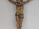 a wooden crucifid hanging on the wall