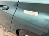a close up of a car door with a sticker on it