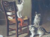 two cats that are sitting on a chair together