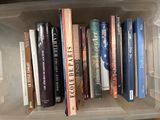 many books in a plastic box on the shelf