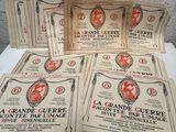 several old french posters of a woman and a man on a table