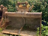 a bulldozer sitting in the middle of a field