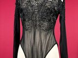 black sheered bodysuit with long sleeves on mannequin torso