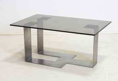 an image of a glass and metal coffee table