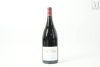 a bottle of wine that is sitting on a table