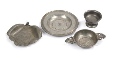 three pewwares and a bowl on a white surface