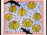 black cat and yellow cactuses on a checkered tablecloth with a black bird