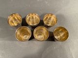 six silver cups sitting on top of a table next to each other