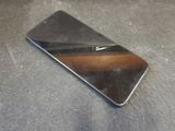 a cell phone that is laying on the floor