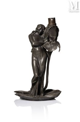 statue of a man holding a woman on a boat