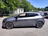 a silver car that is parked in the parking lot