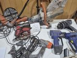 a table with a bunch of power tools on it