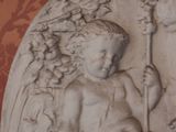 a statue of a boy and a girl sitting on a bench
