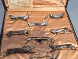 a case that has a bunch of silver spoons in it