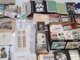many different types of stamps on the table