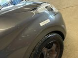 a close up of a car ' s hood with a sticker on it