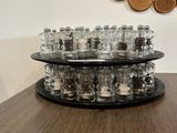 a table that has a bunch of glasses on it