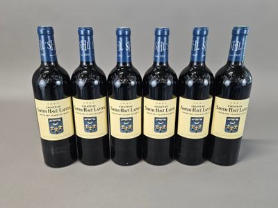 six bottles of red wine are lined up in a row