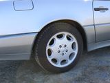 a silver car that is parked on the side of the road