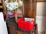 a chair and a cabinet in a room with a lot of clutter